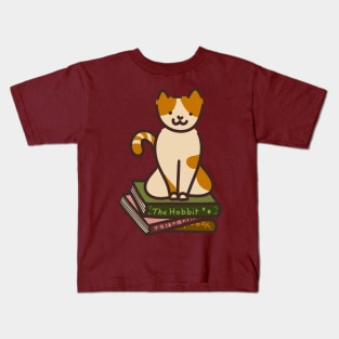 Cat sitting on books Kids T-Shirt